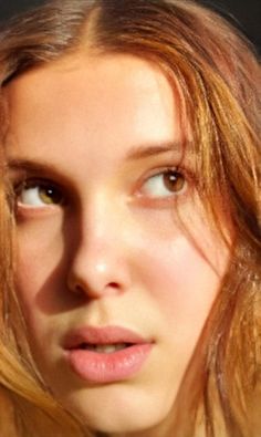 a close up of a person with long hair