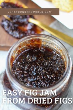 a jar filled with jam sitting on top of a table