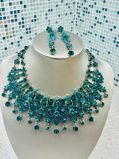 Swarovski crystals adorn the neckline and decollette with this gorgeous piece. Blue and turquoise Swarovski crystals adorn this piece like the colours of the ocean. A beautiful one of a kind piece... Green Crystal Rhinestone Jewelry Sets, Green Crystal Jewelry Sets With Rhinestones, Turquoise Crystal Jewelry For Party, Party Turquoise Crystal Jewelry, Elegant Turquoise Jewelry Set For Party, Elegant Turquoise Jewelry With Rhinestones, Party Turquoise Necklace With Rhinestones, Party Turquoise Crystal Necklaces, Crystals Necklace