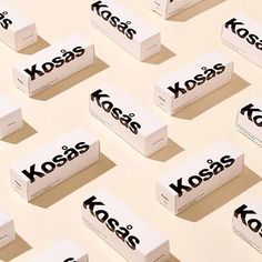 the kosas logo is laid out on top of each other and placed next to each other