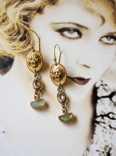 Antique gold plated lion head cuff links repurposed into unique drop earrings, I've paired the links with a clear glass bracelet link in the center and added a unique shape Labradorite drop at the bottom. I love the ear wire I've used the little ball on the wire mimics the texture around the cufflink. Again, like all my jewelry they are one of a kind, easy to dress up or down. Length: 2"1/2 inches long, lightweight. Unique Drop Earrings, Earrings Antique, Glass Bracelet, Antique Earrings, Lion Head, Cuff Links, Pretty Jewellery, Girls Best Friend, Ear Wire