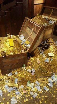 a pile of gold coins sitting on top of a wooden trunk with the words gratidao gratidado gratiao