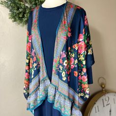 Liza Lou's Umgee Navy Print Mix Kimono Cardigan Top    Beautiful Kimono that can be paired with many different colors of layering dresses!  Has a soft Satin feel! 100% Polyester Bohemian V-neck Cardigan With Floral Print, Bohemian Long Kimono For Layering, Long Bohemian Kimono For Layering, Summer Kimono For Layering, Summer Long Sleeve Kimono For Layering, Summer Layering Long Sleeve Kimono, Long Sleeve Summer Kimono For Layering, Flowy Long Sleeve Cardigan For Spring, Bohemian Kimono For Layering, One Size