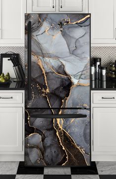 a black and gold marble refrigerator in a kitchen