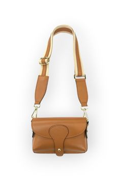 Elevate your style with the Wallen Tan Leather Mini Bag ! This genuine leather mini bag comes with a crossbody strap for easy, hands-free use. Measuring at 7.25 x 4.25 x 1.5 inches, this bag is the perfect size for your daily essentials. The soft, supple leather provides a luxurious feel, while the tan color adds a touch of sophistication to your look. With its sleek and compact design, this mini bag is the perfect addition to any outfit.   Features:   Genuine leather material for a soft and sup Brown Leather Phone Bag With Detachable Strap, Cognac Crossbody Shoulder Bag With Mobile Phone Pocket, Cognac Crossbody Shoulder Bag With Mobile Phone Holder, Cognac Crossbody Shoulder Bag With Mobile Phone Bag, Cognac Crossbody Shoulder Bag With Phone Pocket, Leather Crossbody Phone Bag With Adjustable Strap, Leather Travel Bag Strap With Mobile Phone Bag, Leather Bag Strap With Mobile Phone Bag For Travel, Brown Satchel Mobile Phone Bag Strap