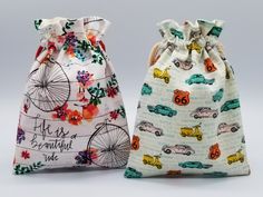 two drawstring bags with different designs on them