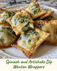 spinach and artichoke dip wonton wrappers on a white plate with green lettering