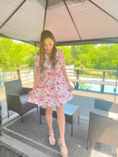 Be a flowery dream in our "Off White Floral Print Ruched Dress". This darling and feminine dress is perfect for your next daytime spring or summer event! This dress features short sleeves, floral print throughout, and a V-neck adjustable ruched tie front. Pair yours with sandals or wedges for an effortlessly classy look! Fit: True to size. Model is wearing a Small. Model’s Profile: Size 2, Height 5'4", Bust 32", Jean Size 25 Approximate Measurements: Small - Length 34" ; Bust 32" Medium - Length Ruched Floral Dress With Short Sleeves For Garden Party, Short Sleeve Ruched Floral Dress For Garden Party, Summer Floral Dress With Ruched Short Sleeves, Short Sleeve Ruched Floral Dress For Summer, Short Sleeve Ruched Floral Summer Dress, Summer Floral Dress With Short Sleeves For Garden Party, Feminine Floral Dress With Short Sleeves For Spring, Ruched Floral Short Sleeve Summer Dress, Feminine Short-sleeved Floral Dress For Spring