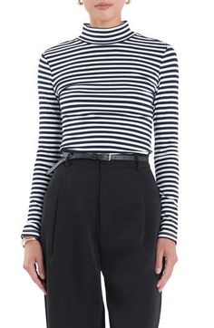 Made from stretchy jersey with crisp stripes, this lightweight turtleneck makes a great layer as the weather cools but also looks perfectly chic on its own. Turtleneck Long sleeves 65% polyester, 30% cotton, 5% spandex Hand wash, dry flat Imported Chic Striped Hem Top For Fall, Striped Stretch Tops For Work, Stretch Striped Tops For Work, Fitted Horizontal Stripe Spring Top, Fitted Long Sleeve Tops With Horizontal Stripes, Classic Striped Tops For Layering, Spring Top With Horizontal Stripe Pattern For Layering, Fitted Spring Tops With Contrast Stripes, Fitted Tops With Contrast Stripes For Spring