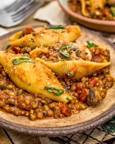 some food is sitting on a plate and ready to be eaten with other dishes in the background