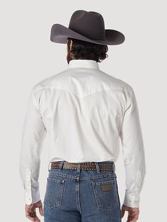 AUTHENTIC DRESS WESTERN SHIRT THAT WEARS WELL DAY IN, DAY OUT. This lightweight long sleeve cotton twill shirt from Wrangler® Painted Desert Basics features traditional Western styling. Classic Relaxed Fit Rodeo Shirt, Classic Relaxed Fit Shirt For Rodeo, Classic Long Sleeve Tops For Rodeo, Western Style Long Sleeve Cotton Shirt, White Long Sleeve Shirt For Rodeo, White Long Sleeve Western Shirt, Cotton Tops With Buttons For Rodeo, Fitted Cotton Shirt For Rodeo, White Western Style Cotton Shirt