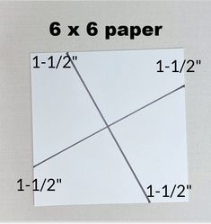 a piece of paper that has been cut in half and is on top of a ruler