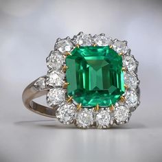 An Impressive Cluster Ring That Features A Lively 4.55 Carat Natural Colombian Emerald Cut Emerald. Colombian Emerald Ring, European Cut Diamond Ring, Estate Diamond Jewelry, Columbian Emeralds, Gia Certificate, Emerald And Diamond Ring, Colombian Emeralds, Gemstone Engagement, 18k Yellow Gold Ring