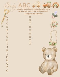 a teddy bear is sitting in front of the baby's name and its letters