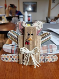 a wooden turkey sitting on top of a table