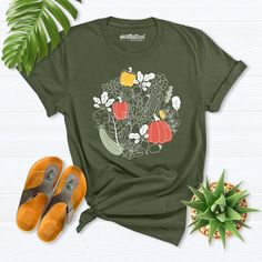 vegetable garden shirt, Cottagecore Clothing, Plant Aesthetic Shirt, Farmer Shirt, Vegetable Print Shirt, Gardening T-Shirt, Gardener Shirt Hello! Thank you for supporting small businesses. My main priority here is the satisfaction of my customers. Fruit Lemon shirts are Bella+Canvas brand. If Bella+Canvas is out of stock, I will send it from a brand of the same size and quality. If you want to see this design on the SWEATSHIRT you can buy it from the link below.https://etsy.me/3LS0Viz Fruit Lem Relaxed Fit Graphic Print Shirt For Gardening, Relaxed Fit Shirt With Graphic Print For Gardening, Green Tops With Plant Print For Fall, Organic Green Short Sleeve Top, Casual Fall Shirt With Plant Print, Summer Cotton Shirt For Gardening, Green Relaxed Fit Shirt With Plant Print, Relaxed Fit Green Shirt With Plant Print, Cotton Shirt For Gardening In Summer