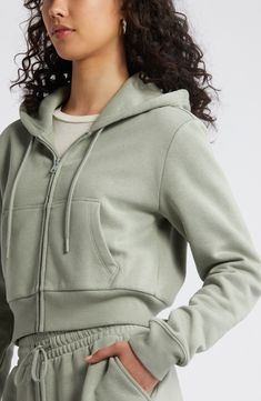 A cropped length makes this fleecy, rib-trimmed hoodie right on trend for cool weather and days when you just want to be cozy. 18" length (size Medium) Front zip closure Drawstring hood Long sleeves Split kangaroo pocket 68% cotton, 32% recycled polyester Machine wash, tumble dry Imported Not available for sale and shipment to Germany Cozy Winter Sweats With Adjustable Hood, Trendy Winter Sweats With Drawstring Hood, Cozy Hooded Hoodie With Ribbed Waistband, Relaxed Fit Cropped Hoodie, Casual Cropped Relaxed Fit Hoodie, Hooded Fleece Sweats With Ribbed Waistband, Sporty Spring Hoodie With Ribbed Waistband, Sporty Hoodie With Ribbed Waistband For Spring, Winter Hoodie With Ribbed Waistband In Relaxed Fit