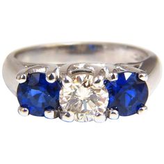 Classic Diamond & Sapphires, Three Stone .80ct. Round Cut diamond Full Cut Brilliant J-color Vs-2 Clarity 5.8mm Side Round Natural Blue Sapphires: 1.68ct. Vibrant Royal Blue & transparent Full cut and Full Faceted. Gorgeous three stone ring 5.4 grams current ring size: 5.25 & We May Resize. Please inquire. 14Kt White gold $15,000 appraisal will accompany. Luxury Three Stone Blue Topaz Ring, Luxury Three Stone Sapphire Ring, Brilliant Cut Sapphire Diamond Gemstones, Classic Platinum Gemstones Gia Certified, Classic Gia Certified Platinum Gemstones, Gia Certified Platinum Classic Gemstones, Three Stone Sapphire Round Ring Fine Jewelry, Blue Sapphire Three Stone Ring With Diamonds, White Gold Diamond Gemstones With Brilliant Cut