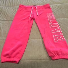 Pink Capri Sweat Pants “Love”. Never Worn Casual Pink Knee-length Bottoms, Casual Pink Cropped Bottoms, Casual Pink Cropped Leg Pants, Casual Pink Capri Pants, Casual Pink Capri Length Pants, Pink Jumpsuit, Sweat Pants, Pant Jumpsuit, Capri