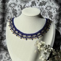 "Cobalt and gold necklace - inspired by the color palette and bright contrast in Vincent Van Gogh's Starry Night. Meticulously hand-beaded in New Jersey, U.S.A. Created with premium Miyuki Glass beads - these Japanese beads are known for their durability and uniformity.   This art deco style necklace gives the illusion of lace, and would make a perfect 3rd wedding anniversary present (glass), or the \"something blue\" in your wedding. Adjustable length: 14-16 inches. Designed to sit just above the collarbone. Gold-toned spring closure." Elegant Handmade Blue Beaded Necklaces, Artisan Blue Jewelry With Gold Beads, Gold Necklaces With Bead Caps For Party, Handmade Blue Beaded Necklaces For Celebration, Gold Party Necklaces With Bead Caps, Traditional Blue Jewelry With Bead Caps, Elegant Blue Necklaces With Gold Beads, Elegant Blue Beaded Necklaces With Bead Caps, Gift Gold Beaded Necklaces With Bead Caps