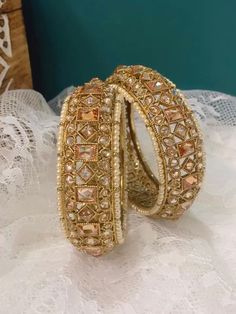 Polki pachili style bangle Shaila in antique gold. Antique based and champagne stone. Pearl lining . About one inch in width. Brass made. Top class polki. Heavy Kundan Bangle For Wedding, Hand Set Kundan Bollywood Bangle, Bollywood Kundan Bangle With Hand Set, Heavy Bollywood Bangle For Weddings, Gold Kundan Chandbalis With Stone Work, Traditional Festive Bangle With Stone Work, Bollywood Kundan Bangle For Wedding, Festive Kundan Bangle With Stone Work, Kundan Bangle With Intricate Design For Diwali