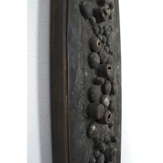 a wall mounted clock with skulls on it