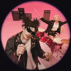 an image of two people on stage with microphones and drum sticks in front of them