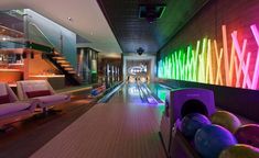 bowling alley with neon lights and bowling balls