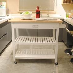 a kitchen island with two stools in front of it