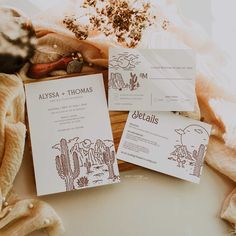 some papers are laying on top of a table with rocks and other items around them