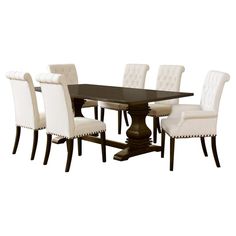 a dining room table and chairs with white upholstered backrests on each side