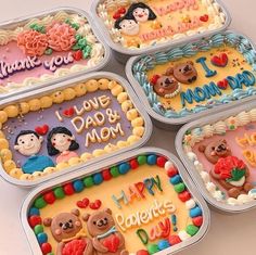 four birthday cakes in tins with teddy bears on them