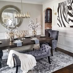 an elegant dining room with zebra print wallpaper