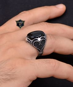 "Turkish Silver Men Ring, Black Onyx Silver Ring, Handmade Gemstone Ring, 925 Sterling Silver Ring, birthday gift, Ottoman Jewelry ✦ Details ✦ * Material: 925 Sterling Silver * Gemstone: Onyx * Weight: 13.00 grams * The size of the stone: 15x20 mm. * Sides oxidized, decorated with Garnet stones and Micro Zircon stones. * Stamp: 925 * Available sizes; 5 US to 16 US. Contact me if you need any other size! ✦ Shipping ✦ * Processing time: 1-3 business days. * This item ships from my Turkish workshop in Istanbul. * Add your phone number in address box for a smoother delivery. That makes courier personnel's job easier.  ✦ Packaging ✦ * Comes with a luxury gift box and a jewellery cleaning cloth. ✦ Returns, Exchanges ✦ * Return option available for 30 days after the delivery. * The product has to Luxury Men's Sterling Silver Ring With Oxidized Finish, Luxury Onyx Men's Ring Gift, Silver Onyx Signet Ring Luxury Style, Silver Onyx Gemstone Signet Ring, Onyx Silver Ring, Ottoman Jewelry, Luxury Silver Onyx Men's Ring, Silver Men Ring, Jewelry Details