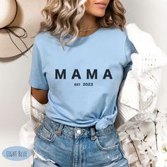 Show off your love and excitement for the upcoming arrival of your newest family member with our Mama est 2023 Tee. Crafted from high-quality materials, this comfy and stylish tee is the perfect pregnancy announcement. Click to buy now and start looking forward to the day your little one arrives. Taylor Swift Jean Jacket, Taylor Swift Concert Outfit, Dance Mom Gifts, Equestrian Shirt, Camp Shirts, Step Mom Gifts, Cowgirl Shirts, Taylor Swift Concert, Presents For Mom