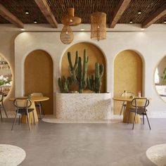 the interior of a restaurant with tables and chairs, cactus in vases on the wall