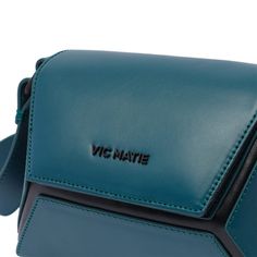 Vic Matie' petrol green Small Sofia crossbody bag, magnetic closure, 1 slot, adaptable strap, frontal tone on tone logoComposition: 100% Calf Leather Green Logo Crossbody Shoulder Bag, Green Top Handle Bag With Logo, Modern Green Bags With Logo, Green Crossbody Bag With Logo, Green Logo Crossbody Bag, Green Top Handle Shoulder Bag With Logo, Blue Top Handle Shoulder Bag With Logo, Blue Crossbody Shoulder Bag With Logo, Blue Logo Crossbody Shoulder Bag