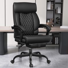 an office chair with black leather upholstered back and arm rests in front of a bookcase