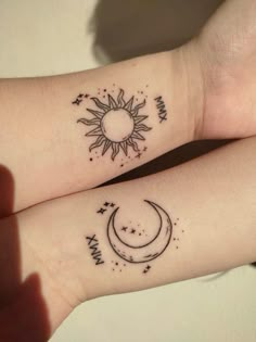 two wrist tattoos with the sun and moon on them