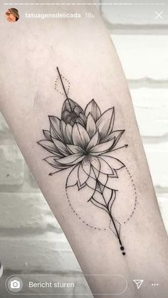 a lotus flower tattoo on the arm