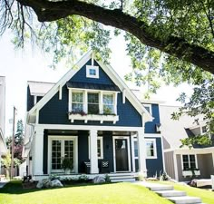 a blue and white house with steps leading up to it