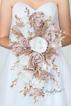 a bride holding a bouquet of flowers in her hands