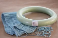 a blue and white knitted object on top of a table