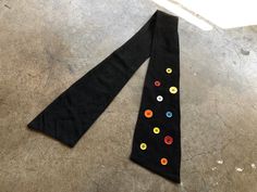 "Made in Italy. Size 65/6. Wool viscose cotton mix. Excellent condition. Functions like a neck kerchief. Measures approx: 3\"-4.5\"wide x 36\"-38\" long." Black Cotton Scarf For Winter, Black Cotton Winter Scarf, Black Cotton Scarves For Winter, Black Cotton Casual Scarves, Casual Black Cotton Scarves, Casual Black Cotton Scarf, Retro Multicolor Winter Scarf, Neck Kerchief, Kerchief Scarf