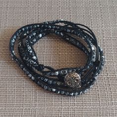 This Is In Handmade, Handcrafted Leather And Beaded Wrap Bracelet. This Is Brand New And Has Never Been Worn. The Bracelet Has Black/White Beads On Black Leather. There Are Three Closure Holes And A Sugar Skull Button Closure. This Is 39" Long And It Is 35"-37" Around The Wrist. I Will Combine Shipping. Thanks For Looking! Hand Wrapped Black Beaded Bracelets For Beach, Black Hand Wrapped Wrap Bracelet For Festival, Hand Wrapped Black Jewelry For Beach, Hand Wrapped Black Beach Jewelry, Adjustable Black Hand Wrapped Wrap Bracelet, Black Hand Wrapped Beaded Bracelets For Festival, Adjustable Hand Wrapped Black Wrap Bracelet, Hand Wrapped Black Beaded Bracelets For Festivals, Festival Hand-wrapped Black Beaded Bracelets