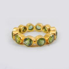 Minimalist Ring- Peridot Handmade Eternity Band Ring- Gemstone Ring- Stackable Ring- Gold Plated Brass Ring- Anniversary Gifts- Boho Ring Description : ~ Material : Brass & Gemstone ~ Gemstone : Peridot Hydro ~ Gemstone Shape : Round ~ Stone Size : 4 mm Approx ~ Ring Weight : 2.85 Gram Approx ~ Setting Type : Bezel ❣❣ Handmade Item ❣❣ **Made to Order** » G E M S T O N E S D E T A I L S « **Gemstone structure may vary from the image as two gemstones do not have the same structure** If you wan Stackable Round Peridot Jewelry, Stackable Peridot Gemstone Rings, Peridot Gemstone Stackable Rings, Gifts Boho, Green Stone Rings, Gold Rings Stackable, Eternity Band Ring, Gold Band Ring, Minimalist Ring