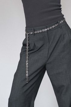 Refined and versatile, the Eris Silver Chain Belt is a statement piece that reflects Lapo Lounge's commitment to timeless design. Made from durable stainless steel, this belt showcases a minimalist yet striking chain-link pattern. Wear it to cinch your waist, pair it with trousers or style it as a necklace for a fresh, fashion-forward approach to accessorizing. Whether you're dressing up or down, the Eris is designed to enhance any ensemble with a touch of modern luxury. The chain is completely Silver Chain Belt, Silver Gold Necklace, Pant Chains, Hair Charms, Streetwear Inspo, Fresh Fashion, New York Studio, Chain Belts, Silver Belts