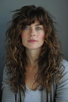 Layers and bangs instantly elevate long hair. These 49 hairstyles for 2024 have us swooning over the shape, movement and intrigue of long layered locks with fringe. 👆 Click for more ideas！ Naturally Wavy Bangs, 2b Haircut Bangs, Long Bangs Long Curly Hair, Loose Perm With Bangs, Long Wavy Shag Haircut With Bangs, Long Shag Natural Wavy Hair, Haircuts For Wavy Curly Hair Long Layered Bangs, Wolfcut Hair Long Wavy With Bangs, Curly Hair Cuts With Bangs