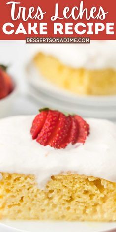 a piece of cake with white frosting and strawberries on top is sitting on a plate