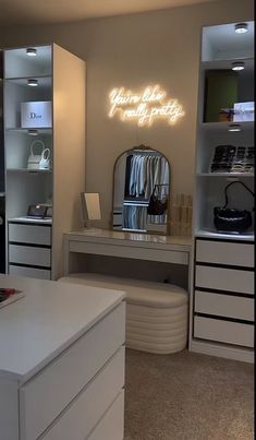 a white desk and some drawers in a room